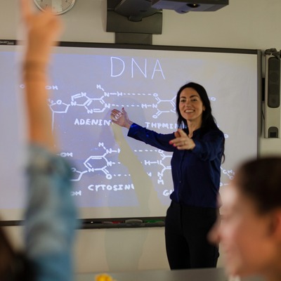 A teacher calling on a student during a science lesson