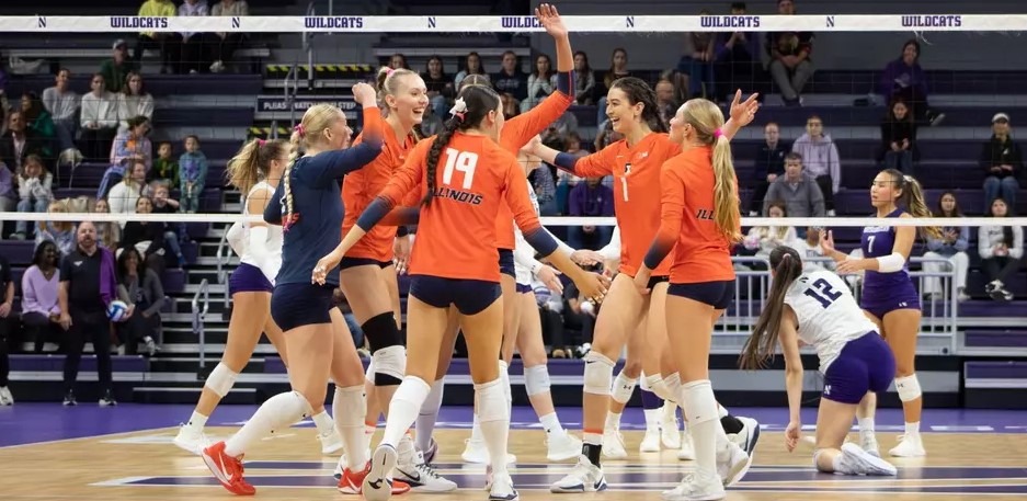The Illini celebrate a kill during their match against Northwestern
