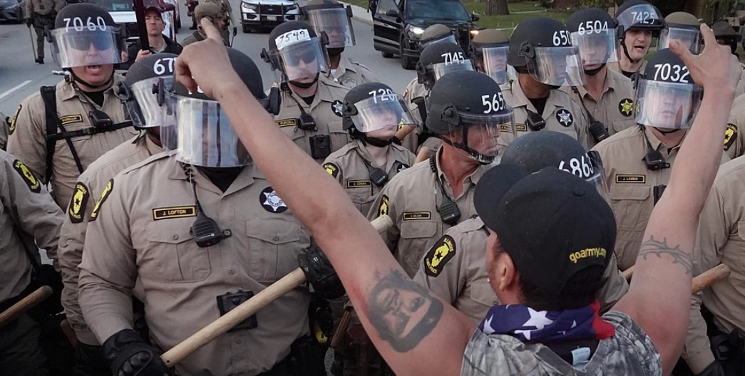Police confront demonstrators during a protest outside an immigration processing and detention facility on Oct. 11 in Broadview, Ill. Photographer: Scott Olson/Getty Images