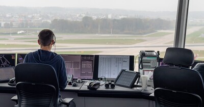 air traffic controller works in a tower. Photo via Wikimedia Commons