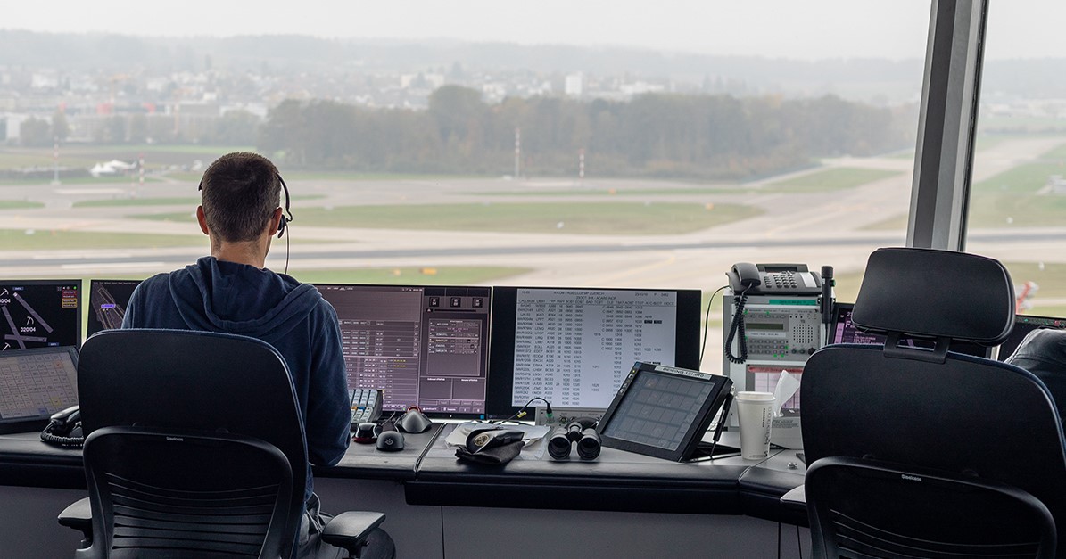 air traffic controller works in a tower. Photo via Wikimedia Commons