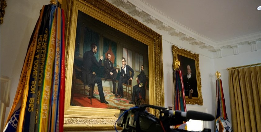 A painting of President Abraham Lincoln is visible on the wall during a Cabinet meeting at the White House in July. Andrew Harnik/Getty