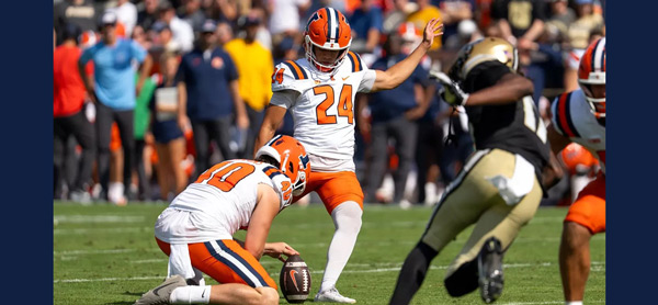 David Olano kicks a field goal against Purdue