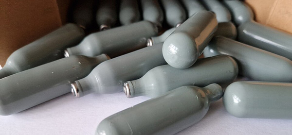stock image of nitrous oxide cannisters via Wikimedia Commons