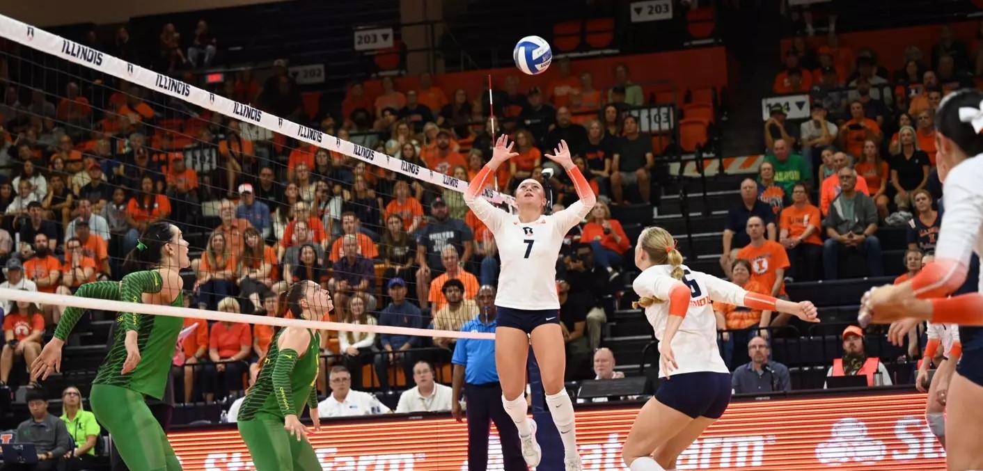 Kenna Phelan sets the ball for a teammate who is ready to deliver a kill