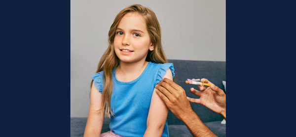stock photo of young girl receiving a vaccination shot. Wikimedia Commons