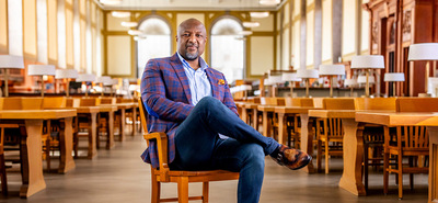 Chancellor Charles Isbell sits in the Reading Room at the library. Photo by Michelle Hassel