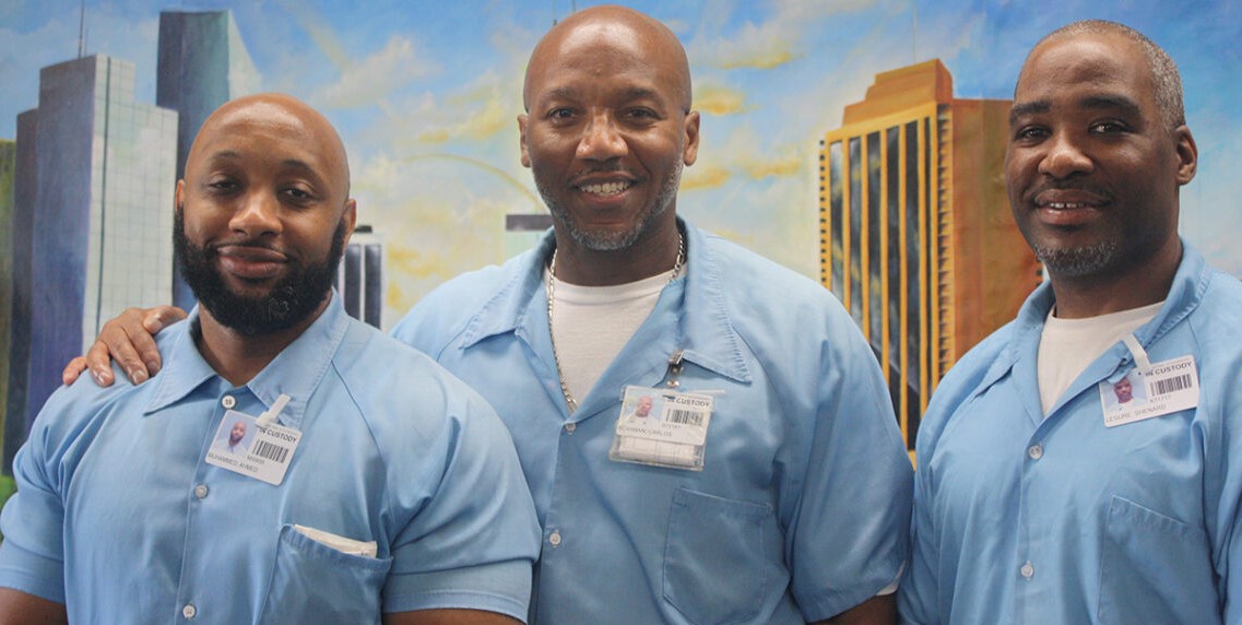 Education Justice Project students Ahmed Mohammed, Carlos “Ben El” Bowman and Shenard Lesure. Photo courtesy Rebecca Ginsburg