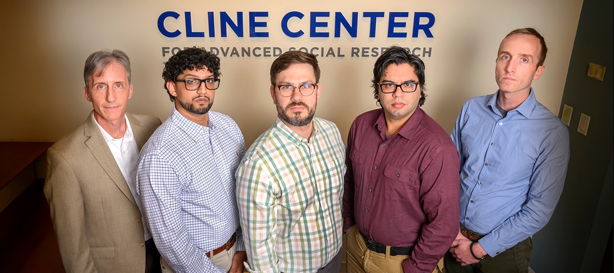 The Cline Center for Advanced Social Research team. From left: Scott Althaus, director and the Merriam Professor of Political Science at Illinois; Ajay Singh, postdoctoral research associate; Jay Jennings, research scientist; Michael Martin, research coordinator; and Joseph Bajjalieh, research manager. Not pictured: Jennifer K. Robbennolt, the Alice Curtis Campbell Professor of Law at Illinois. Photo by Fred Zwicky