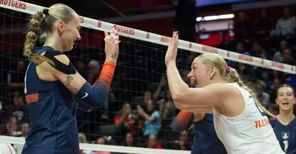 Illinois volleyball players laugh, grin and high five after a play at Rutgers