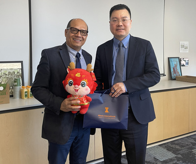 Dr. Luis Canales, Associate Provost for Illinois International, and Consul Yi Wang from the Consulate General of the People’s Republic of China in Chicago, pose for a photo during a Feb. 19 visit.