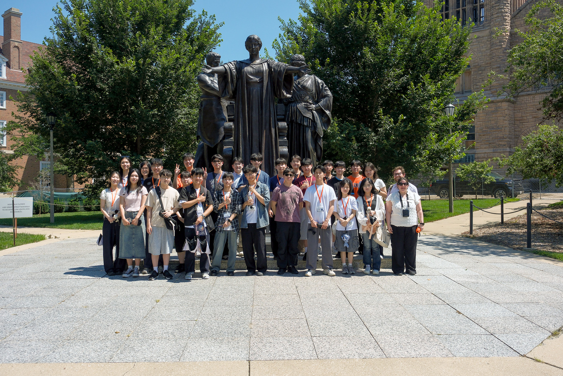 Twenty-four students from South Korea’s Chungnam National University, their advisor, and two Global Education and Training staff members, pose for a group photo in front of the University of Illinois Urbana-Champaign's Alma statue on July 17, 2026.