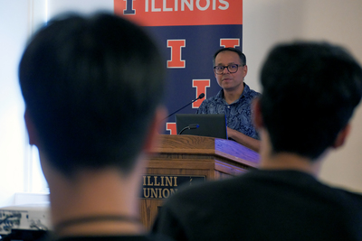 Romit Choudhury, Ph.D., a professor in The Grainger College of Engineering, gives a speech during the recognition ceremony for the AI and Generative Models: From Algorithms to Applications research program on August 7, 2026 inside the Illini Union.