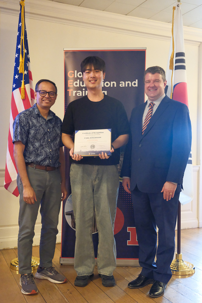 Jonghyeon Park (center), a computer science and engineering major at Chungnam National University, holds up a certificate and poses for a photo with Romit Choudhury (left), professor in The Grainger College of Engineering; and GET Director Matt Rosenstein (right) following the recognition ceremony for the AI and Generative Models: From Algorithms to Applications research program on August 7, 2026.