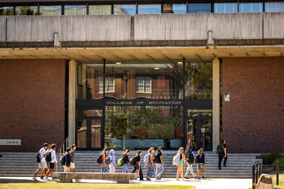 Photo shows students walking in front of the College of Education on the University of Illinois Urbana-Champaign campus.