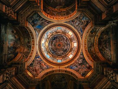 The photo, which was taken looking directly up, shows the ceiling inside the Duomo di Napoli in Naples, Italy. The photo was taken by Zaree Ascan. She took the photo during an independent travel study period, where she and other classmates were tasked with exploring other cities outside of Barcelona to sketch, experience, and analyze spaces in detail. Ascan submitted this photo for the 2025 Study Abroad Photo contest and won in the LANDSCAPE category.