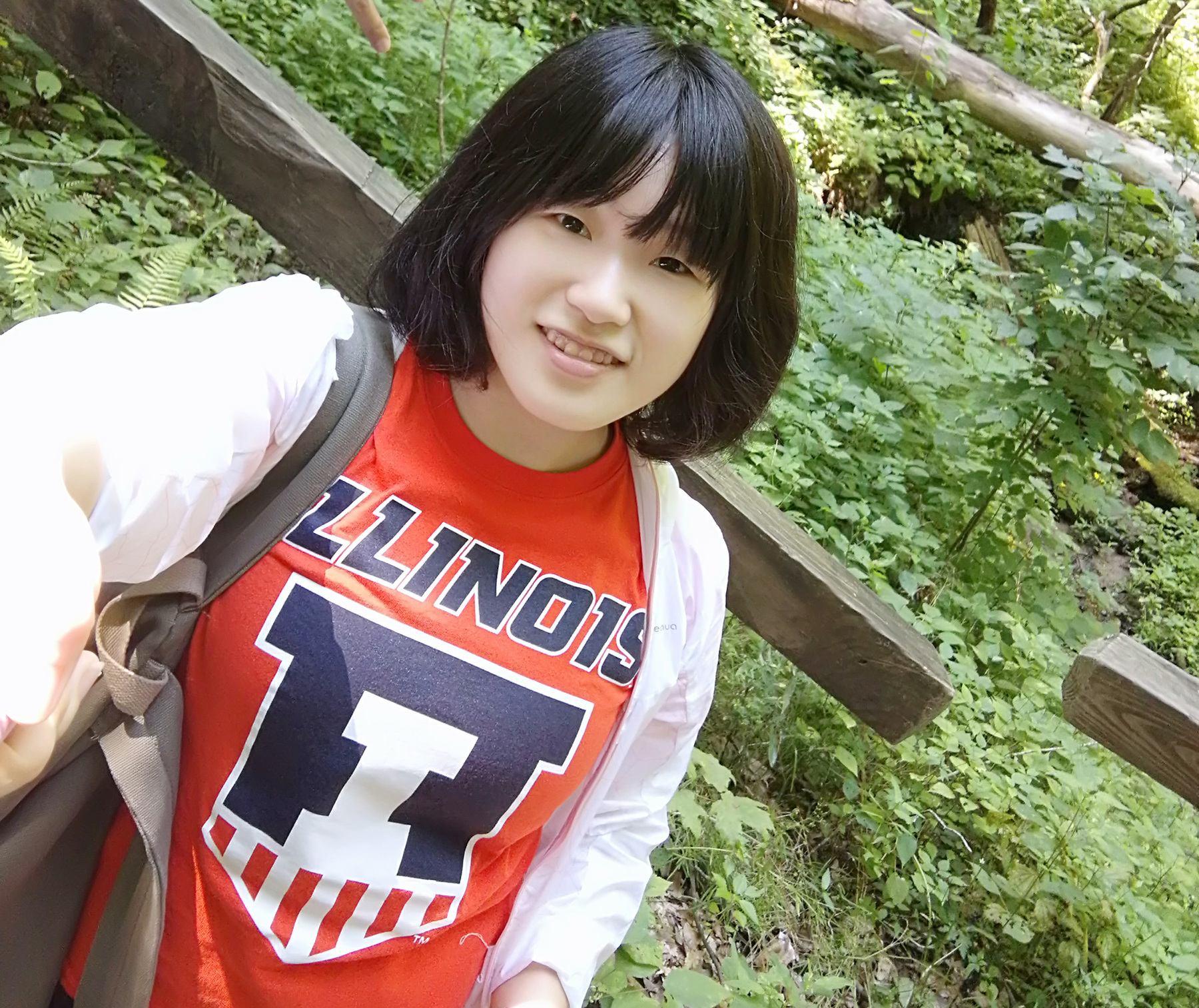 Jiayi Li takes a selfie in Illinois merch