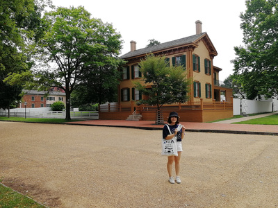 Jiayi Li stands in front of a historic campus building at the University of Illinois