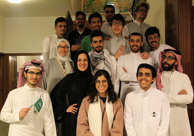 Doha Amer poses with KGSP at Illinois community members