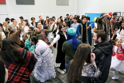 A room filled with individuals dancing