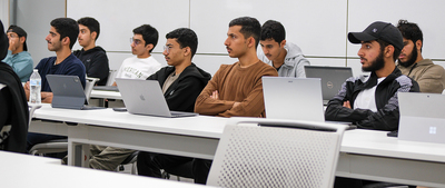 Omani students participating in the new foundation year program hosted by GET listen to Anna Kasten, the program manager, during a meeting on Oct. 27, 2023 inside the Siebel Center for Design.