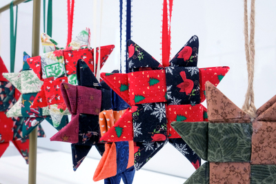 Several star-shaped ornaments hang suspended from a necklace holder during a Jan. 7 workshop.
