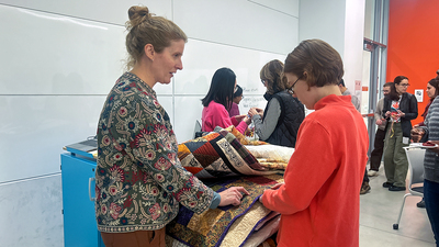 Kathryn Burden, associate director for international training and programs at Illinois International, speaks with a graduate student during a Jan. 7 workshop inside the Siebel Center for Design.