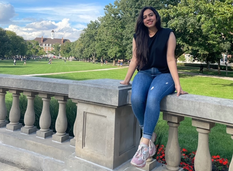 Nermeen Abdelmaged poses in fornt of Foellinger Hall