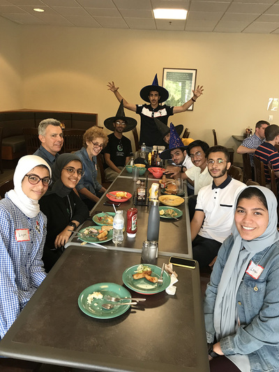 Lisa Chason enjoys a meal with the KGSP Foundation Year students in 2019