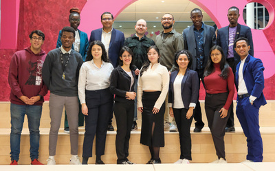 Fourteen of the 15 fellows from this semester's Fulbright Fellow cohort pose for a photo during a welcome reception on Feb. 6 inside the Siebel Center for Design.