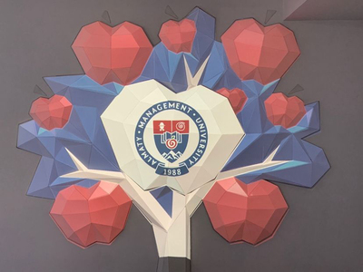 A logo representing Almaty Management University (AlmaU).