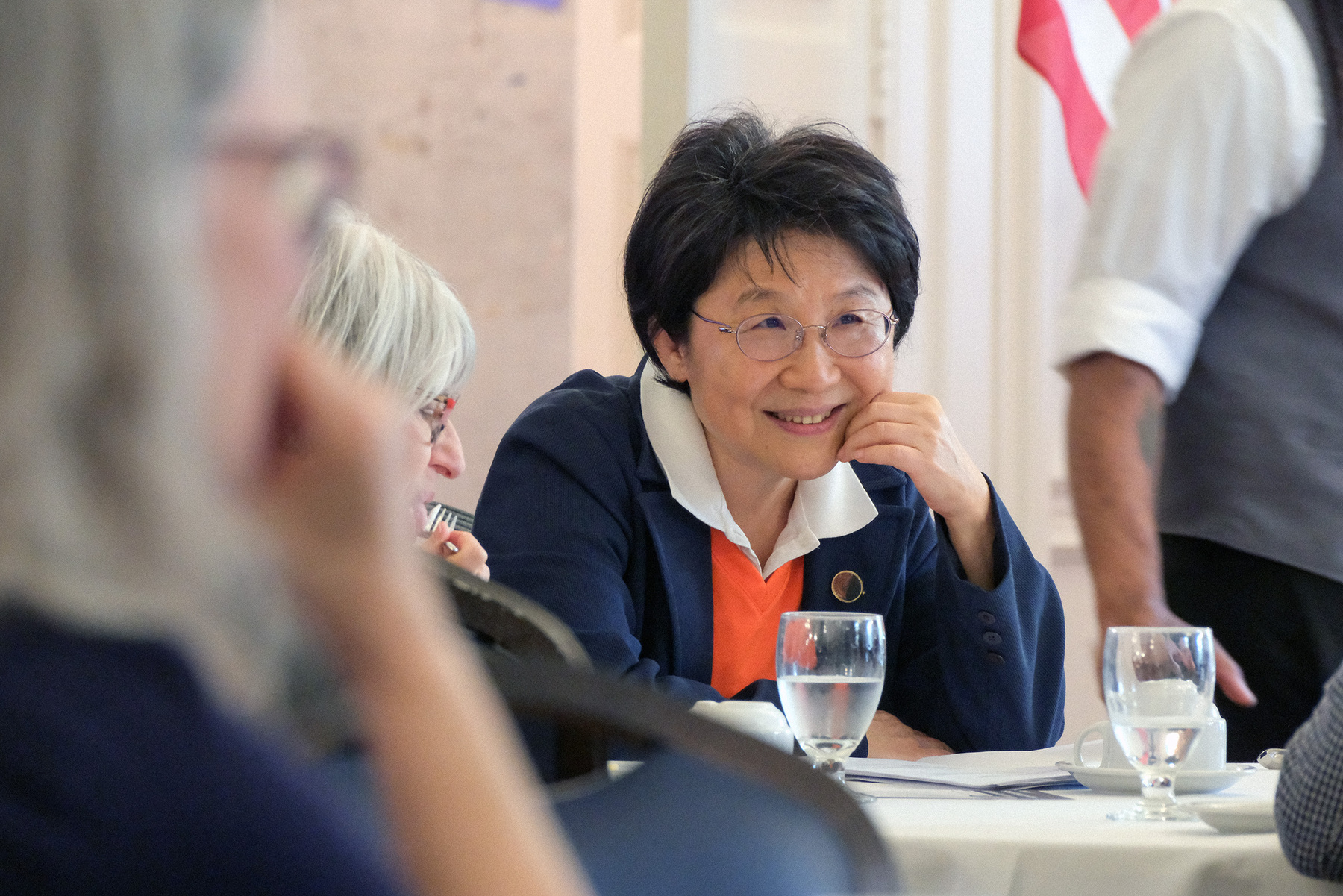 Prof. Joyce Yen Feng, the recipient of the 2026 Madhuri and Jagdish N. Sheth International Alumni Award for Exceptional Achievement, listens to her colleagues and friends before the start of the 2026 Sheth Distinguished Alumni Lecture on April 28.