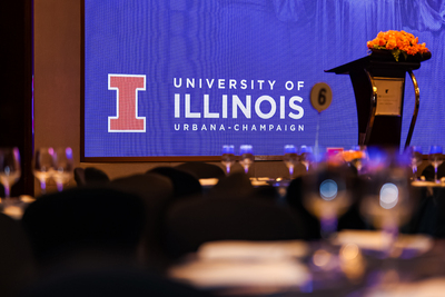 A snapshot of the University of Illinois logo on a screen during the 30-year anniversary celebration.