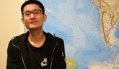 Guangzhou poses in front of world map