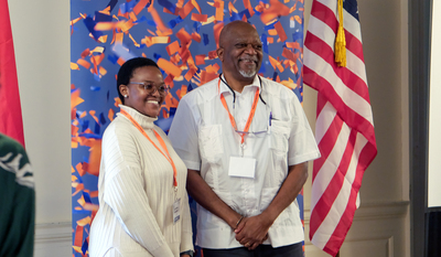 Koketso Mogadima (left), project administrator for FPP UJ, and Andrew Kaniki (right), academic advisor to the FPP and Illinois alumnus, pose for a photo during the program closing reception on April 22 inside the Illini Union.