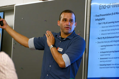 Manny Rodriguez, Associate Director for Teaching Excellence and Research at CITL, leads the July 20 orientation inside Room 182 at the Armory.