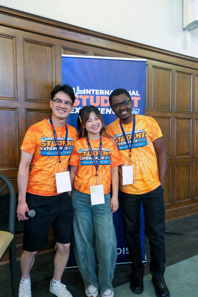 William Zhang Sam, a master’s student in the Siebel School of Computing and Data Science, Miaomiao Wei, a Ph.D. student in the Education Policy, Organization and Leadership Department, and Valentine Ugwuoke, a Ph.D. student in the School of Information Sciences, pose for a photo during the Graduate Connections Meet-up on Aug. 18 inside the University YMCA.