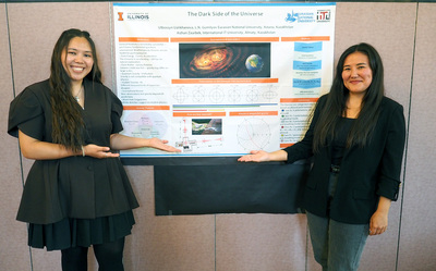 Bolashak scholars Aizhan Zaurbek (left), an instructor at International IT University in Almaty, Kazakhstan, and Ulbossyn Ualikhanova (right), an instructor at Gumilyov Eurasian National University in Astana, Kazakhstan, pose in front of their research poster at the Bolashak 2025-2026 Research & Professional Development Showcase on May 8 inside the Illini Union.