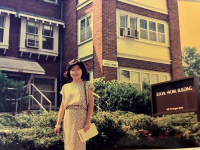 Prof. Joyce Yen Feng stands in front of the former School of Social Work on the Illinois campus in the early 1980s
