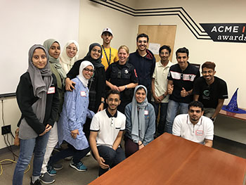 KAUST students post in boardroom