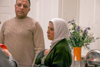 A participant speaks with one of the translators after a break-out session during the Amideast Egypt Study Tour on Feb. 14 inside the Illini Union.