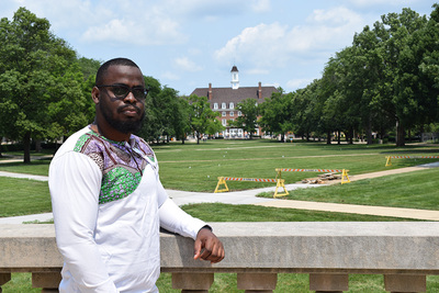 Jeff Valbrun poses in front of Foellinger Hall