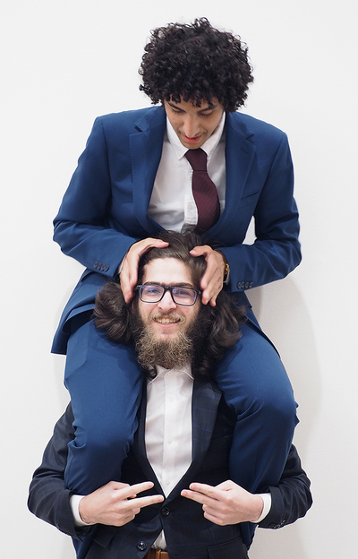 Fares Ibraheem F Pasuni holds Fares Ibrahim A Alghamdi on his shoulders for a funny photo following the end of the May 18 KAUST recognition ceremony inside the I Hotel.