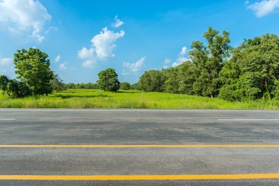 Highway in the foreground and natural landscape in the background