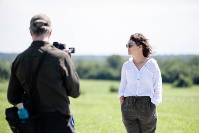 Sarah Baires stands in a field