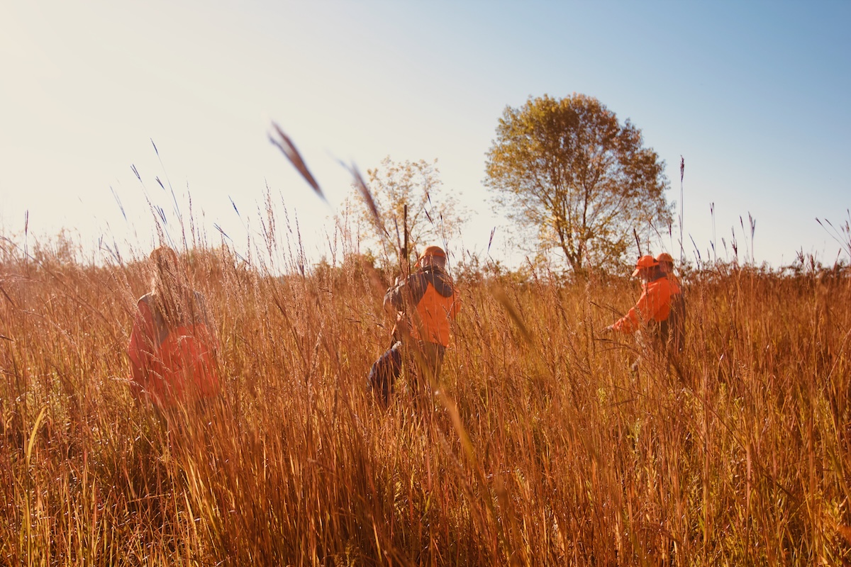 Learn to Hunt participants walk through a field