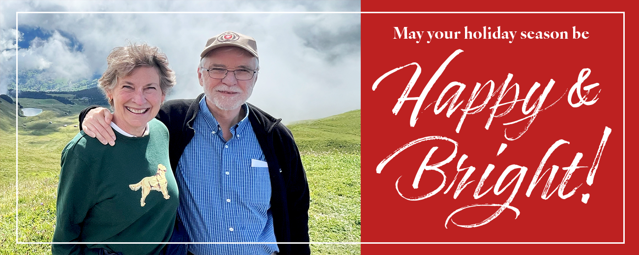 Image of President Tim Killeen and Dr. Johnson Killeen next to a bright red message that says, "May your holiday season be happy and bright!"