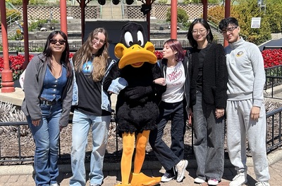 Zoey Zhang at Six Flag with friends and Daffy Duck