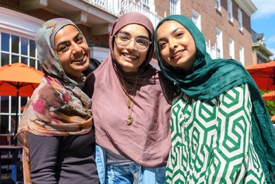 Friends on the porch of the Illini Union take a break from studying for finals. Photo taken at the University of Illinois Urbana-Champaign on Tuesday, May 6, 2025. (Photo by Craig Pessman / University of Illinois Urbana-Champaign)