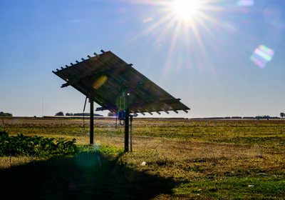 a solar panel in a farm field